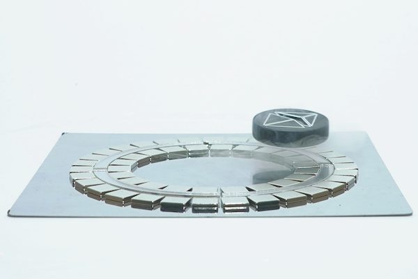Superconductor levitating above a circular magnetic track in a cloud of nitrogen vapour