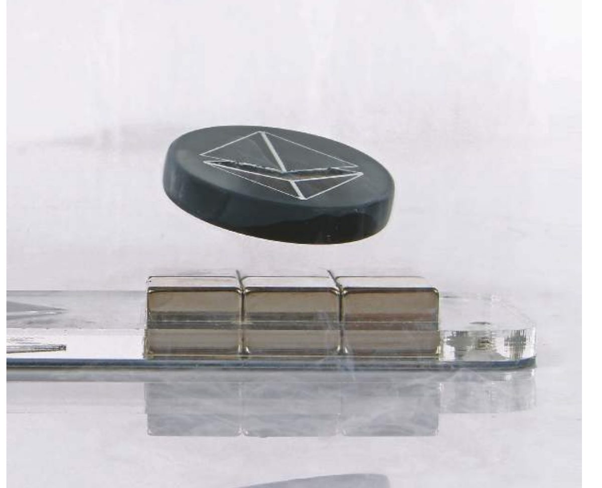 A magnet locked above a Quantum Levitator