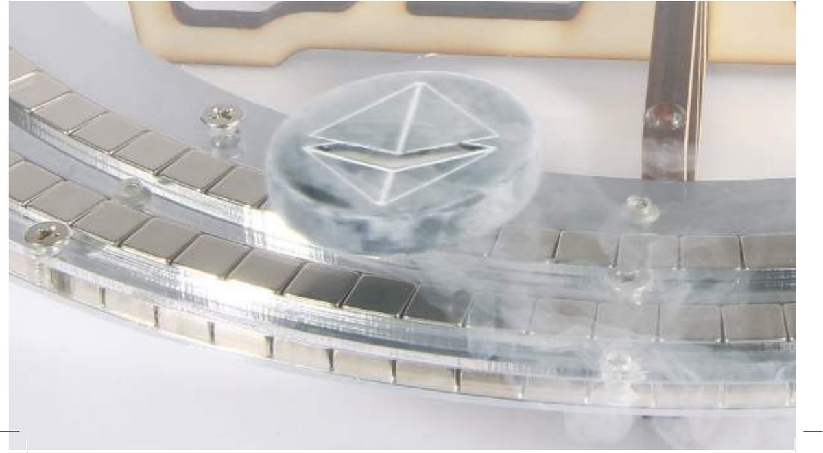 A Quantum Levitator locked above the circular maglev track, liquid-nitrogen vapour trailing behind it