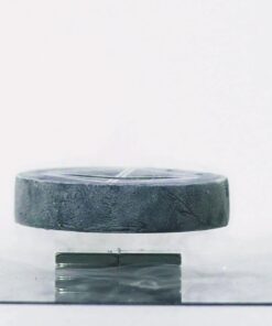 Quantum Levitator floating above a magnet, close up